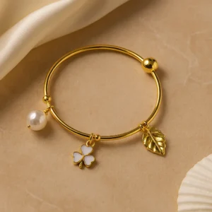 Gold plated bracelet with pearl clover and leaf charm