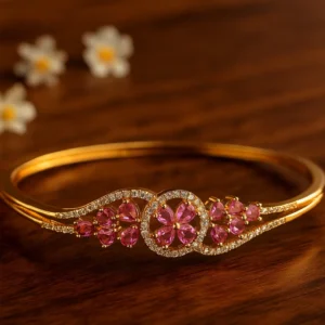 Pink floral diamond bracelet in gold tone with shimmering accents for festive and wedding occasions