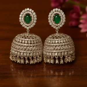 Emerald studded diamond jhumka earrings with silver finish for wedding collection