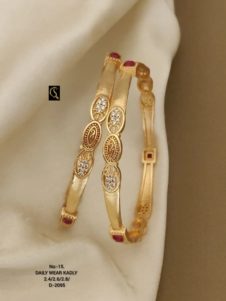 Classic slim kadli bangles with oval motifs and sparkling stone accents