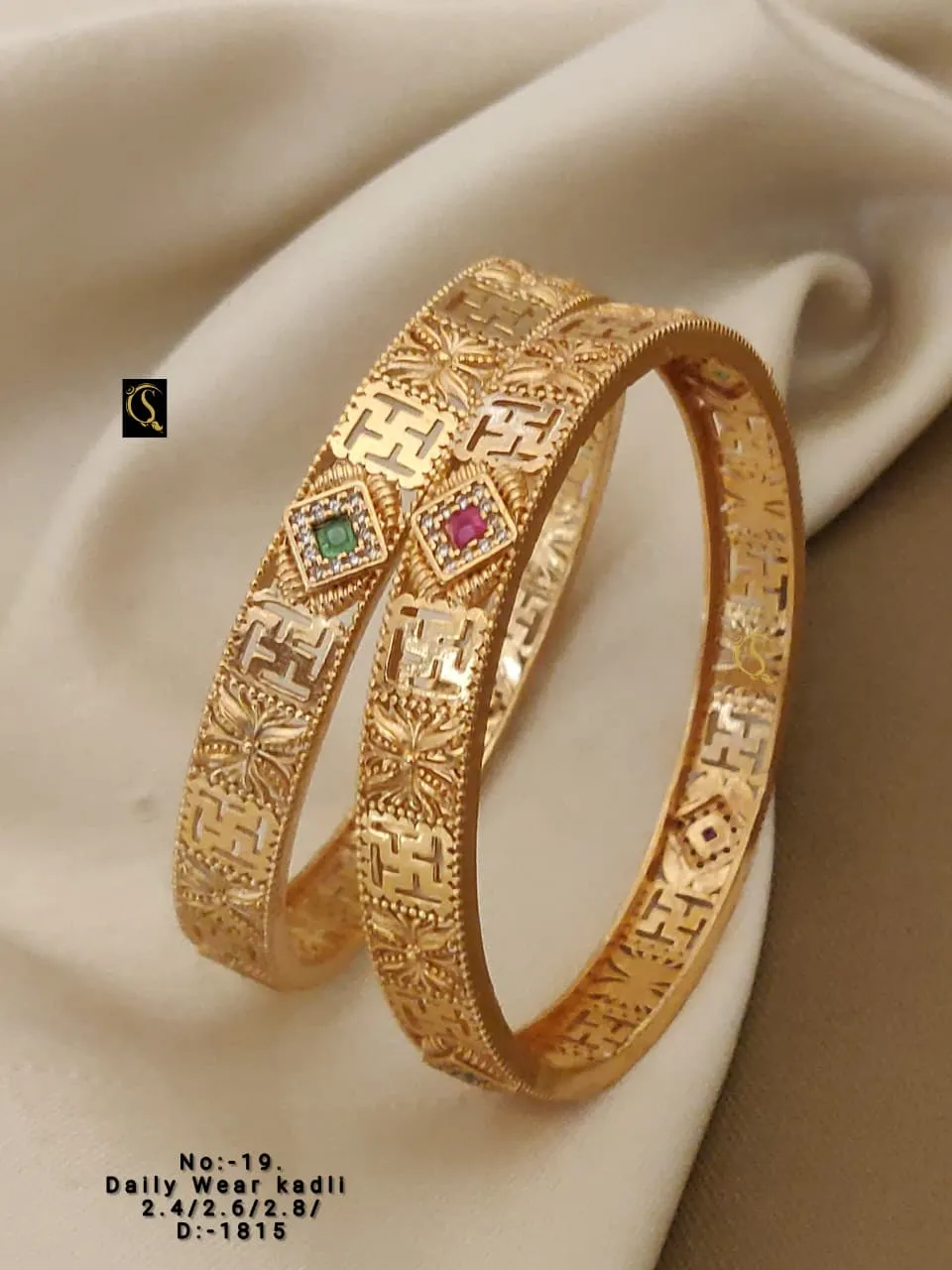 Heavy look kadli bangles with intricate carving and colorful stone centers