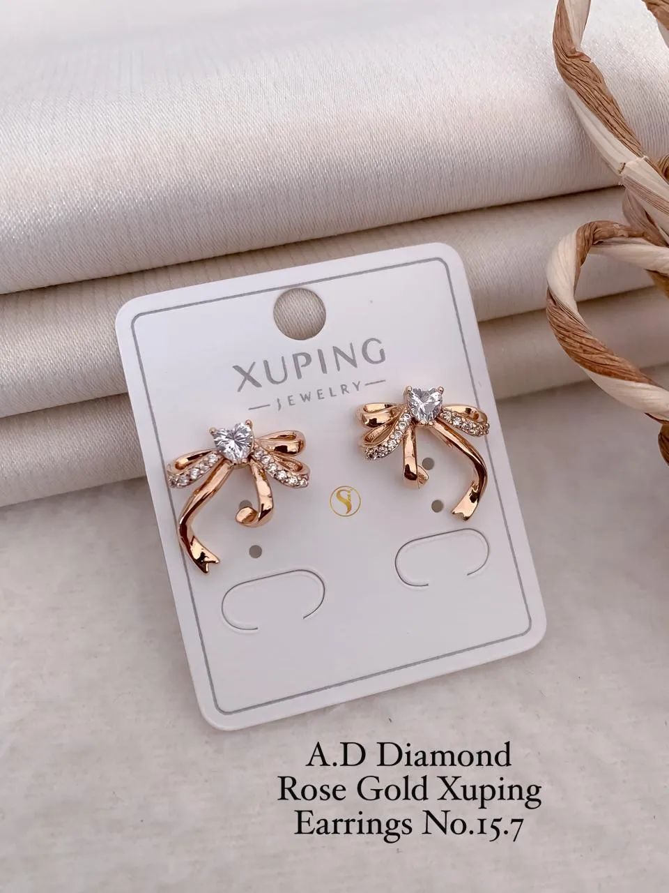 Ad diamond rose gold ribbon heart stone designer stud earrings