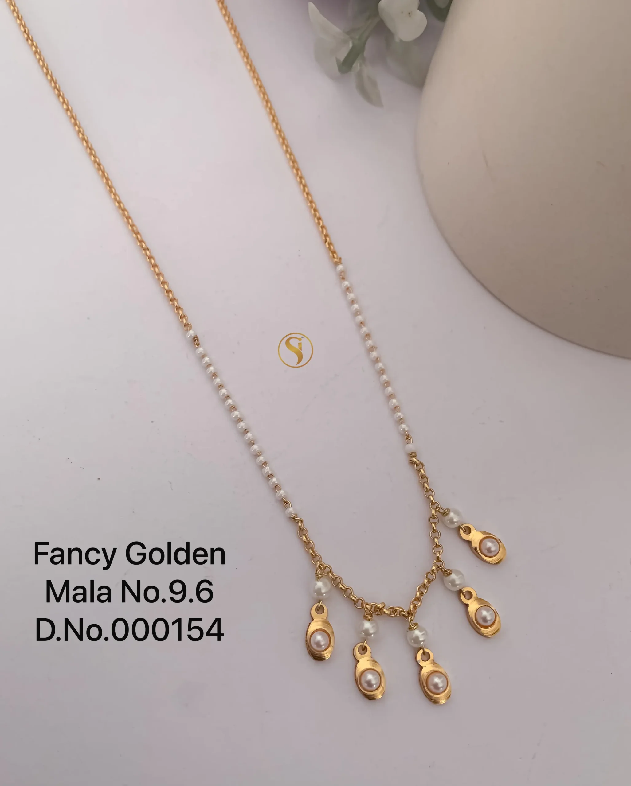 Fancy golden mala with elegant pearl charm drops