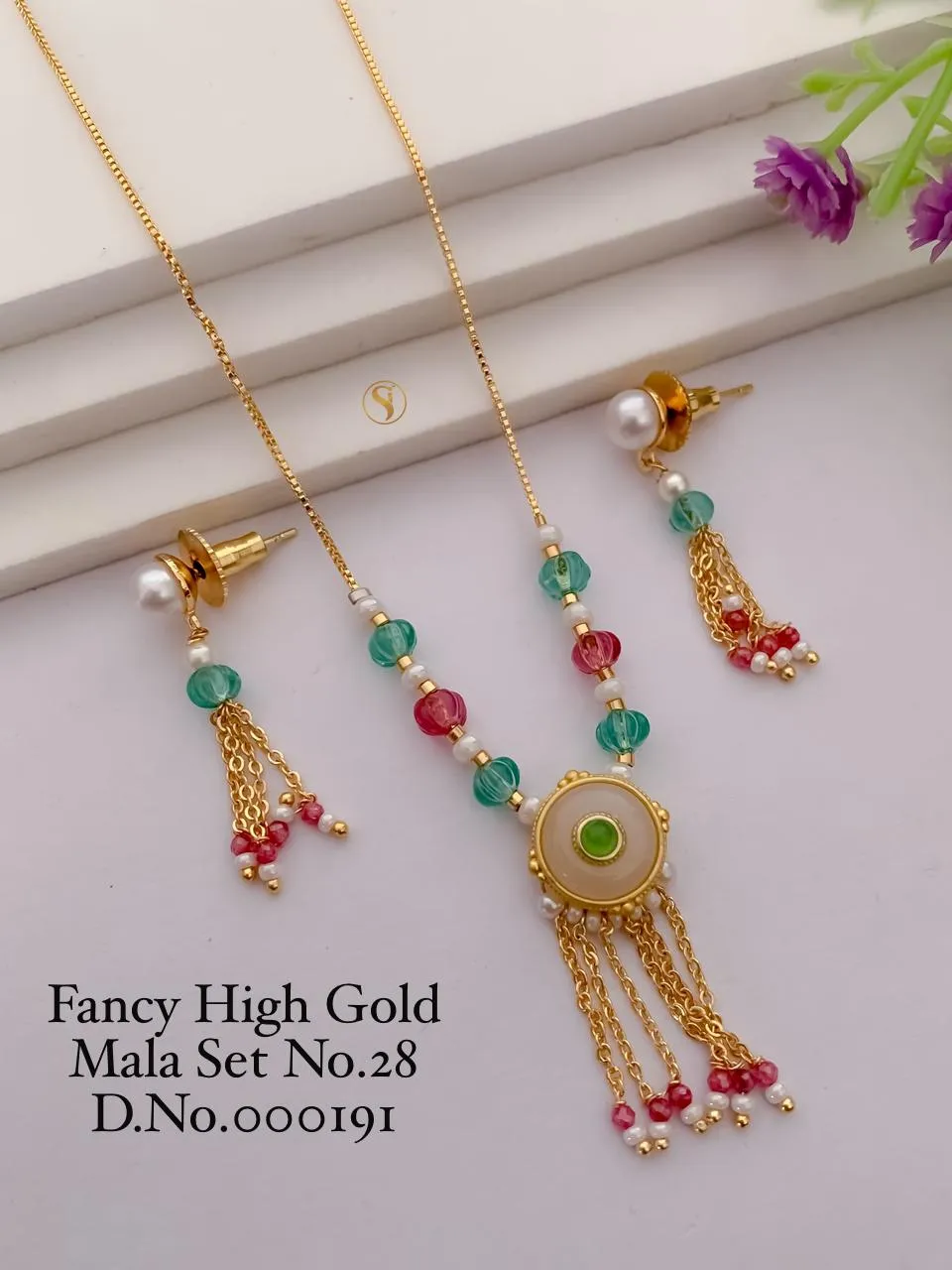 Fancy high gold moti mala set with matching earrings