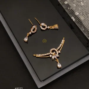 Direct gold ad stone pendant earrings set with delicate curve and teardrop design