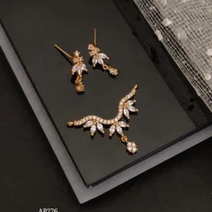 Direct gold ad stone pendant earrings set with floral vine curve design