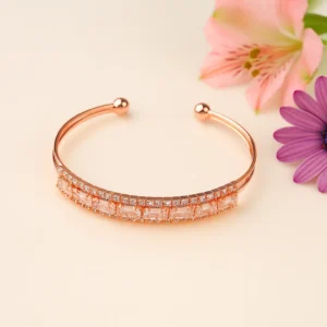 Elegant rose gold open cuff bracelet with shimmering crystal baguettes